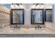 Close up of the bathroom vanity featuring double sinks, quartz countertops, and wood framed mirrors at 4266 E Cassia Ln, Gilbert, AZ 85298