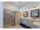 Elegant bathroom featuring a glass walk-in shower and double sink vanity with framed mirrors at 4266 E Cassia Ln, Gilbert, AZ 85298