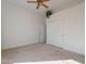 Spacious bedroom with sliding closet doors and neutral colored carpet at 4266 E Cassia Ln, Gilbert, AZ 85298