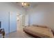 Bedroom featuring a daybed and double doors leading to a tiled hallway at 4266 E Cassia Ln, Gilbert, AZ 85298