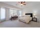 Spacious bedroom with lots of natural light, including a desk and a ceiling fan at 4266 E Cassia Ln, Gilbert, AZ 85298