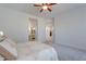 Bright bedroom with ceiling fan and ensuite bathroom at 4266 E Cassia Ln, Gilbert, AZ 85298