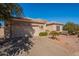 Inviting single-story home featuring a two-car garage and desert landscaping at 4266 E Cassia Ln, Gilbert, AZ 85298