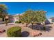 Well-maintained home with desert landscaping, rocks and mature trees at 4266 E Cassia Ln, Gilbert, AZ 85298