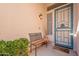 Inviting front porch with a cozy bench, decorative welcome mat, and charming wall lantern at 4266 E Cassia Ln, Gilbert, AZ 85298