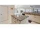 Kitchen featuring a center island with granite countertops and white cabinetry at 4266 E Cassia Ln, Gilbert, AZ 85298