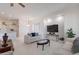 Inviting living room featuring neutral furniture, a large TV, and an open concept layout at 4266 E Cassia Ln, Gilbert, AZ 85298