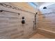 Detailed view of the tiled shower with a built-in bench and a decorative tile accent at 4266 E Cassia Ln, Gilbert, AZ 85298