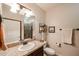 Guest bathroom featuring a granite vanity, toilet and a step-in tiled shower at 5350 E Deer Valley Dr # 1275, Phoenix, AZ 85054