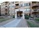 Inviting building entrance with stone accents, a covered walkway and well maintained landscaping at 5350 E Deer Valley Dr # 1275, Phoenix, AZ 85054