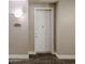 Entry front door with white painted trim and wood grain vinyl flooring at 5350 E Deer Valley Dr # 1275, Phoenix, AZ 85054