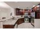 Kitchen boasts stainless steel appliances, granite countertops, tile flooring and rich, dark cabinetry at 5350 E Deer Valley Dr # 1275, Phoenix, AZ 85054