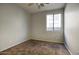 Bedroom featuring neutral paint, carpet, and a window allowing natural light at 6109 S 30Th Dr, Phoenix, AZ 85041