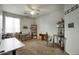 Bright bedroom featuring a ceiling fan, carpet floors and a window at 6109 S 30Th Dr, Phoenix, AZ 85041