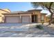 Charming single-story home featuring a two-car garage, desert landscaping, and a welcoming front entrance at 6109 S 30Th Dr, Phoenix, AZ 85041