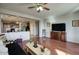 Open-concept living room adjacent to the kitchen, featuring hardwood floors and neutral paint at 6109 S 30Th Dr, Phoenix, AZ 85041