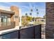 A balcony view of the neighborhood featuring palm trees and mountain views at 6301 N 12Th St # 14, Phoenix, AZ 85014