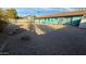 Expansive backyard featuring gravel landscaping and a clear view of the rear of the property at 6413 E Holly St, Scottsdale, AZ 85257