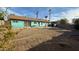 Backyard with rock landscaping and covered patio at 6413 E Holly St, Scottsdale, AZ 85257