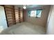 Cozy bedroom featuring built-in shelving and a bright window at 6413 E Holly St, Scottsdale, AZ 85257