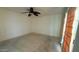 Bedroom with a ceiling fan and sliding glass doors at 6413 E Holly St, Scottsdale, AZ 85257