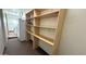 Functional utility area with washer, dryer and shelving units at 6413 E Holly St, Scottsdale, AZ 85257