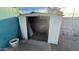 Outdoor storage shed with an open door, concrete foundation, and room for storage at 6413 E Holly St, Scottsdale, AZ 85257