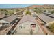 Aerial view of a home with desert landscaping and a covered patio with outdoor furniture at 6589 E Casa De Leon Ln, Gold Canyon, AZ 85118