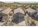 Aerial view of single Gathering home in a desert community with a low maintenance yard at 6589 E Casa De Leon Ln, Gold Canyon, AZ 85118