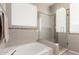 Bathroom featuring a soaking tub and a glass-enclosed shower with tiled surround at 6589 E Casa De Leon Ln, Gold Canyon, AZ 85118