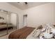 Bedroom featuring plush carpet, sliding mirrored closet, and neutral decor at 6589 E Casa De Leon Ln, Gold Canyon, AZ 85118