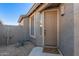 Home's entryway with a Welcome mat and desert plants on either side of the covered porch at 6589 E Casa De Leon Ln, Gold Canyon, AZ 85118