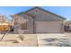 Charming single-story home with desert landscaping, neutral paint, and attached two car garage at 6589 E Casa De Leon Ln, Gold Canyon, AZ 85118