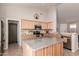 Spacious kitchen with stainless steel appliances, granite counters, and central island at 6589 E Casa De Leon Ln, Gold Canyon, AZ 85118