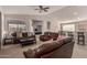 Open concept living room with neutral walls and carpet, and views to kitchen and dining at 6589 E Casa De Leon Ln, Gold Canyon, AZ 85118