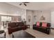 Open concept living room with neutral walls, ceiling fan, and views to kitchen and dining at 6589 E Casa De Leon Ln, Gold Canyon, AZ 85118