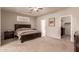 Large main bedroom with a ceiling fan, carpeting, and access to ensuite at 6589 E Casa De Leon Ln, Gold Canyon, AZ 85118