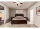 Bright bedroom with a large window, sliding glass door, and soft carpeting at 6589 E Casa De Leon Ln, Gold Canyon, AZ 85118