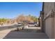 Street view of a home in a desert community surrounded by desert landscaping at 6589 E Casa De Leon Ln, Gold Canyon, AZ 85118