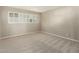 Well-lit bedroom with plantation shutters and neutral carpet at 7345 E Rovey Ave, Scottsdale, AZ 85250