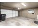 Spacious two-car garage with ample storage space and an automatic garage door at 7345 E Rovey Ave, Scottsdale, AZ 85250