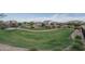 Fenced dog park featuring lush green grass, landscaping, and a secure environment at 7734 W Florence Ave, Phoenix, AZ 85043