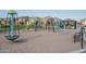 Community playground with modern play structure, slide, and picnic pavilion at 7734 W Florence Ave, Phoenix, AZ 85043