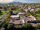 Wide aerial view of the community highlighting mature landscaping, serene atmosphere, and tile roofs at 7920 E Via Camello -- # 49, Scottsdale, AZ 85258