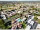 Overhead shot of community highlighting a refreshing pool and lush mature landscaping at 7920 E Via Camello -- # 49, Scottsdale, AZ 85258