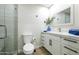 Well-lit bathroom with sleek vanity, quartz countertop, modern fixtures, and a glass-enclosed shower at 7920 E Via Camello -- # 49, Scottsdale, AZ 85258