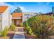 Exterior of a home with desert landscaping and a private walkway at 7920 E Via Camello -- # 49, Scottsdale, AZ 85258