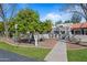 Charming home with a manicured front yard and lush landscaping at 7920 E Via Camello -- # 49, Scottsdale, AZ 85258