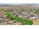 Wide aerial shot displays golf course community with lush landscaping, pools, and desert surroundings at 800 W Palo Brea Dr, Litchfield Park, AZ 85340