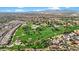 Scenic aerial view of golf course, lush landscaping, water features, and neighboring residential community at 800 W Palo Brea Dr, Litchfield Park, AZ 85340